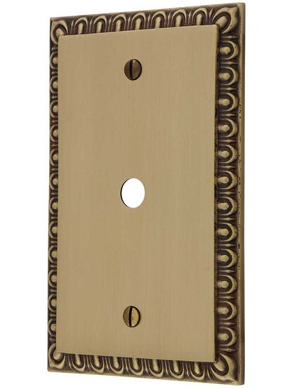 Ovolo Single Cable-Jack Cover Plate in Antique Brass.
